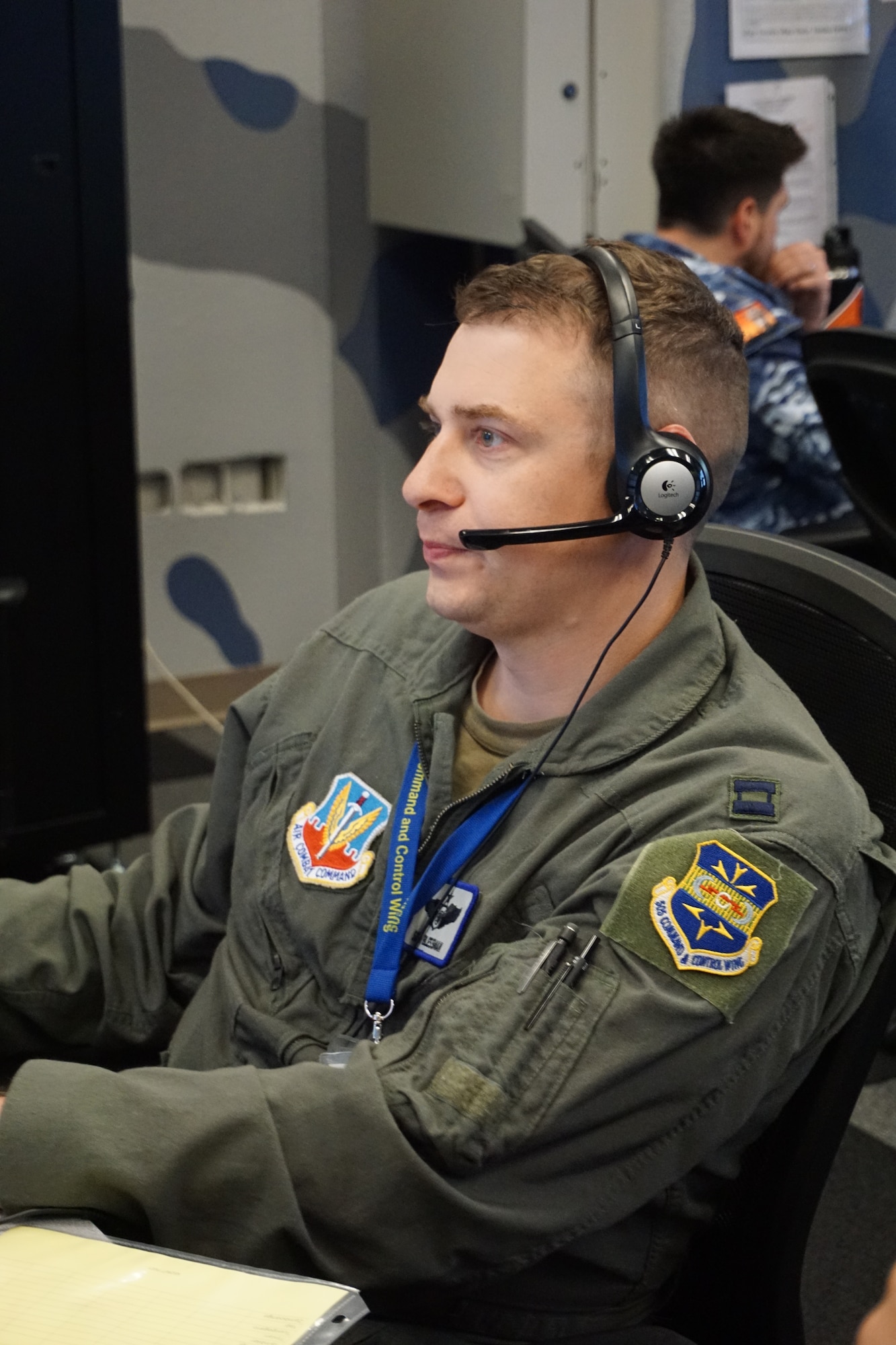 uniformed military member working at a computer