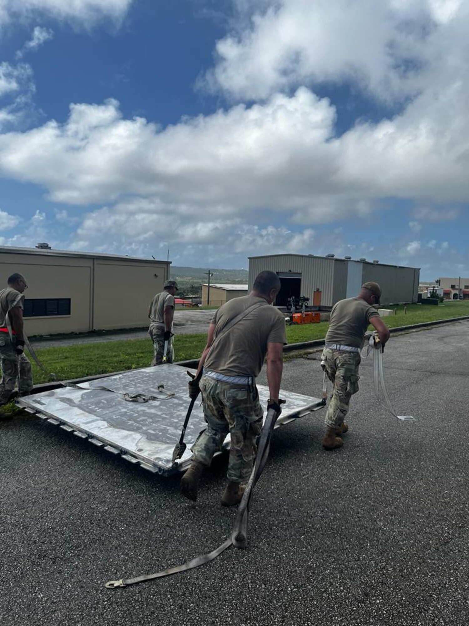 Members of the 36th Tactical Advisory Squadron carry a shipping pallet during a rodeo at Andersen Air Force Base, Guam, Nov. 14, 2023. This event was held to showcase the Multi-Capable Airmen concept and develop esprit de corps through friendly competition. (Courtesy photo)