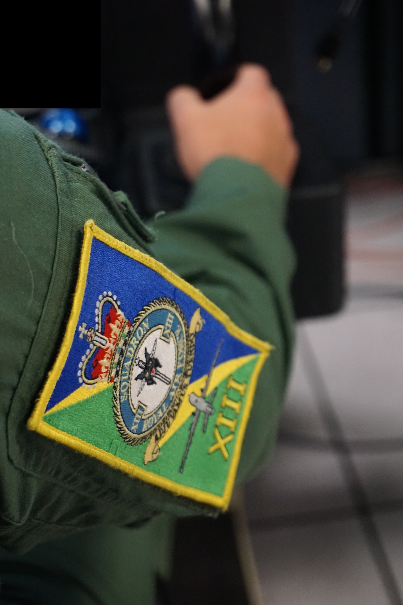 patch of  Royal Air Force unit on the arm of MQ-9 pilot