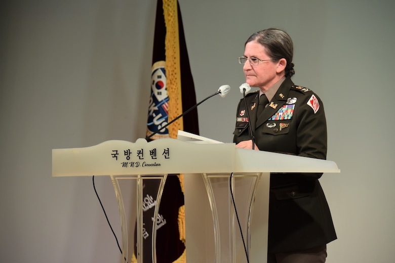 Col. Heather Levy, commander, U.S. Army Corps of Engineers - Far East District, delivers remarks from a podium.