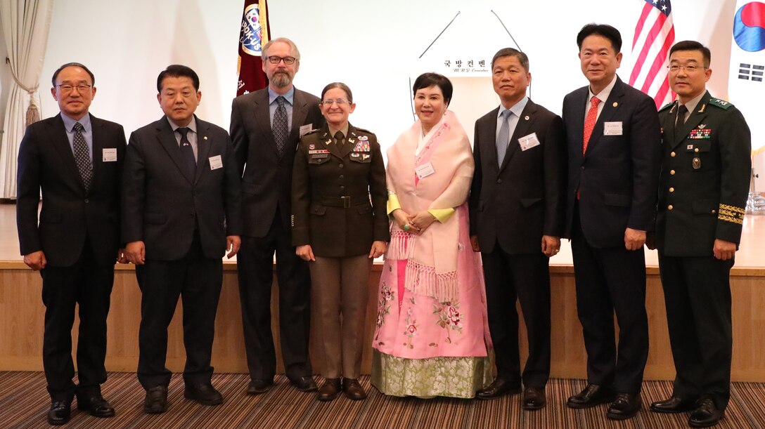 Eight people post in a group photo. Fourth from the left is Col. Heather Levy, commander, U.S. Army Corps of Engineers – Far East District, with Ms. Woo, Hyun-euy, chairperson, Republic of Korea-U.S. Alliance Friendship Association, to her right.