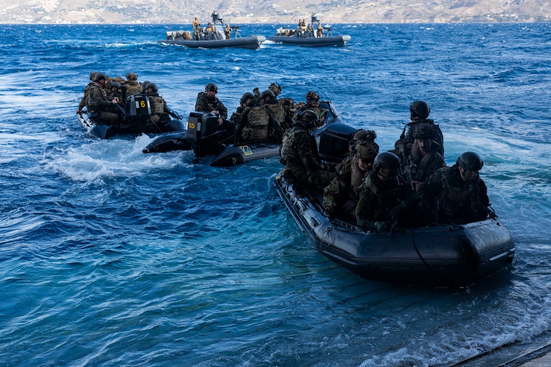 U.S. Marines from the 26th Marine Expeditionary Unit (Special Operations Capable) execute a small-scale amphibious assault alongside Greek Marines with 32nd Hellenic Marine Brigade during a bilateral exercise near Skyros, Greece, Dec. 2, 2023. U.S. Marines and Sailors of the 26th Marine Expeditionary Unit (Special Operations Capable), embarked on the ships of the Bataan Amphibious Ready Group, are on a scheduled deployment as the Tri-Geographic Combatant Command crisis response force with elements deployed to the U.S. 5th Fleet and U.S. 6th Fleet areas of operation to increase maritime security and stability, and to defend U.S., Allied, and Partner interests. (U.S. Marine Corps photo by Staff Sgt. Jesus Sepulveda Torres)