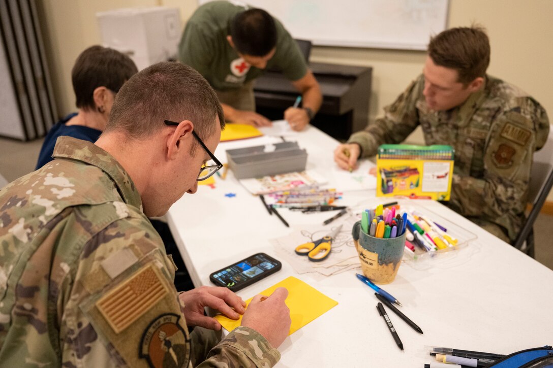 Annual Raider Holiday Cheer event provides gift bags to Airmen