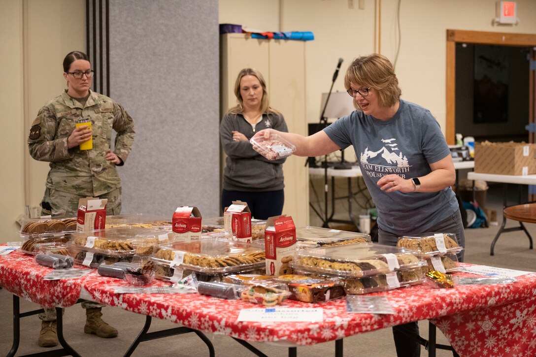 Annual Raider Holiday Cheer event provides gift bags to Airmen