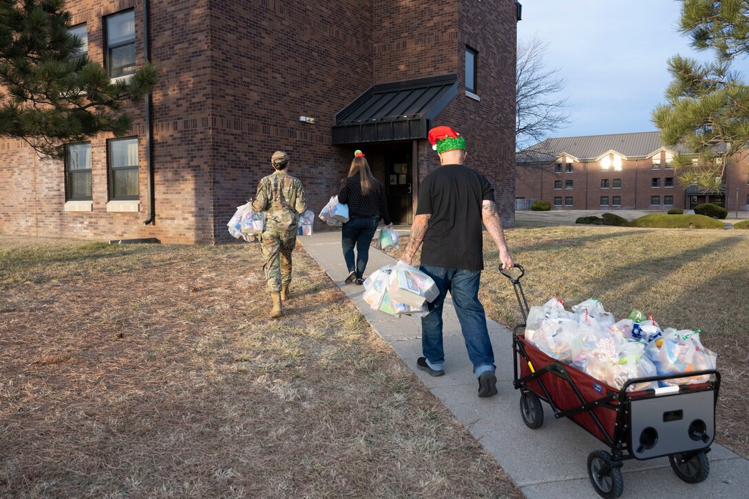 Annual Raider Holiday Cheer event provides gift bags to Airmen