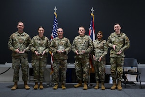 Winners of the 178th Wing Annual Outstanding Airmen of the Year pose for a portrait after the award ceremony in Springfield, Ohio, Dec. 2, 2023. Airmen are nominated for the prestigious award based on their job performance in primary duty, leadership, followership and the whole airman concept. (U.S. Air Force photo by Senior Airman Constantine Bambakidis)