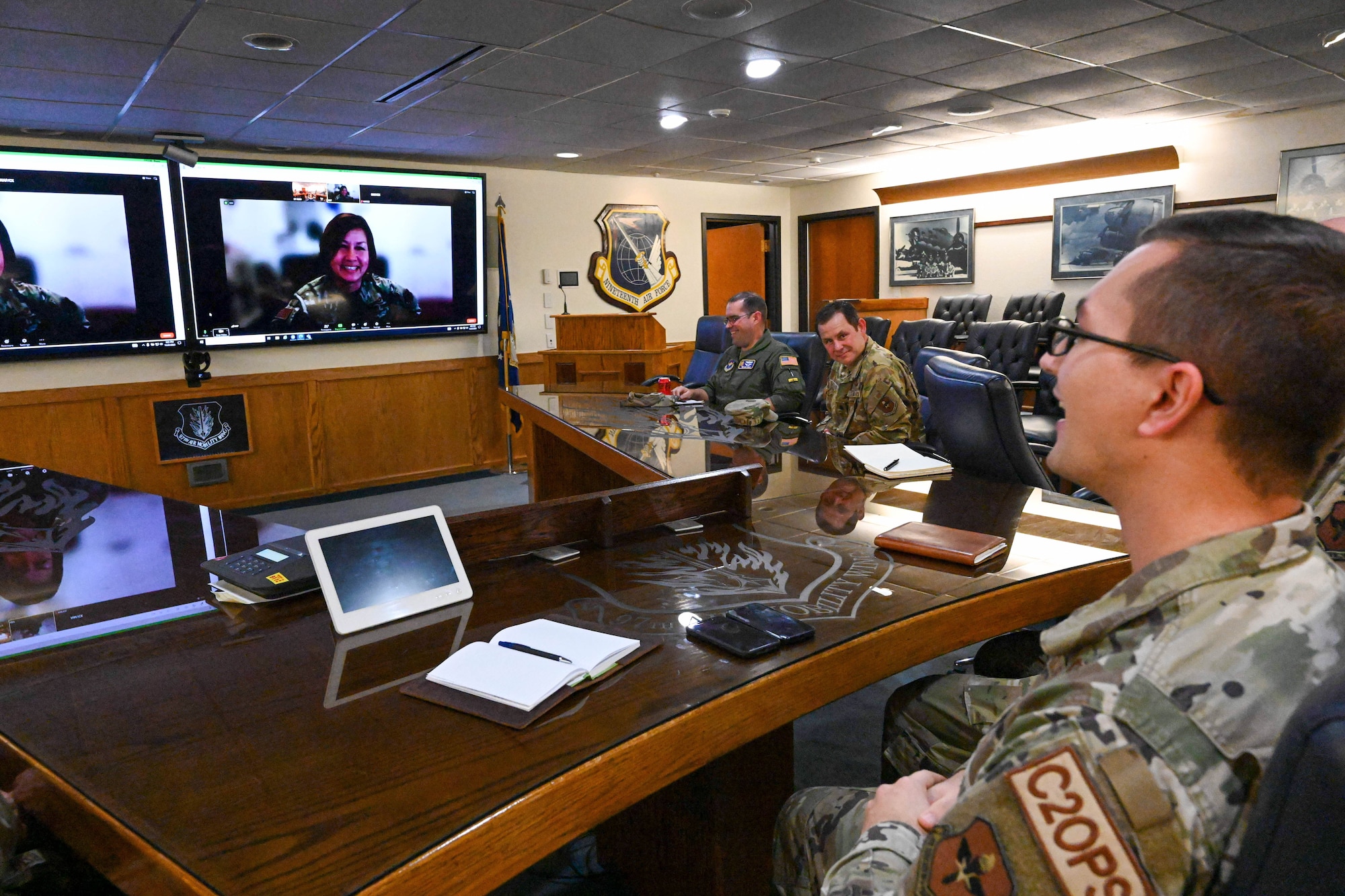 U.S. Air Force Tech. Sgt. Connor Bish, 97th Air Mobility Wing noncommissioned officer in charge of command and control operations, speaks to Chief Master Sgt. of the Air Force JoAnne S. Bass over a video call at Altus Air Force Base, Oklahoma, Nov. 21, 2023. Bish was hand selected by Bass to enter the Senior Leader Enlisted Commissioning Program - Active Duty. (U.S. Air Force photo by Senior Airman Miyah Gray)