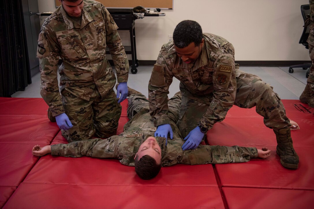 Members of the 128th Air Refueling Wing Security Forces Squadron learn casualty assessment as part of augmentee training Nov. 9 at the Wisconsin Air National Guard base in Milwaukee. The augmentee training program, an essential component of the squadron's operations, prepares selected members to step into specialized roles during periods of heightened security or crisis. 128th Air Refueling Wing photo by Master Sgt. Kellen Kroening