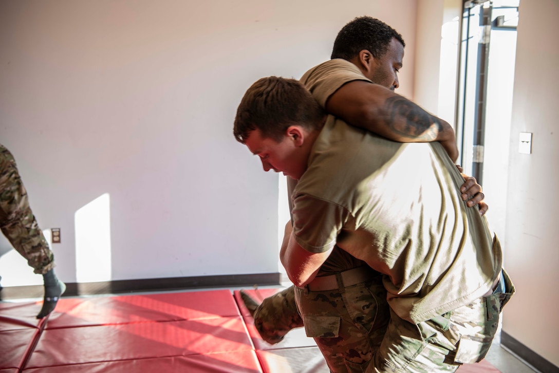 Members of the 128th Air Refueling Wing Security Forces Squadron practice combatives as part of augmentee training Nov. 9 at the Wisconsin Air National Guard base in Milwaukee. The augmentee training program, an essential component of the squadron's operations, prepares selected members to step into specialized roles during periods of heightened security or crisis. 128th Air Refueling Wing photo by Master Sgt. Kellen Kroening