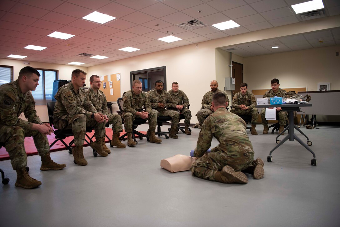 Members of the 128th Air Refueling Wing Security Forces Squadron take part in medical training as part of augmentee training Nov. 9 at the Wisconsin Air National Guard base in Milwaukee. The augmentee training program, an essential component of the squadron's operations, prepares selected members to step into specialized roles during periods of heightened security or crisis. 128th Air Refueling Wing photo by Master Sgt. Kellen Kroening