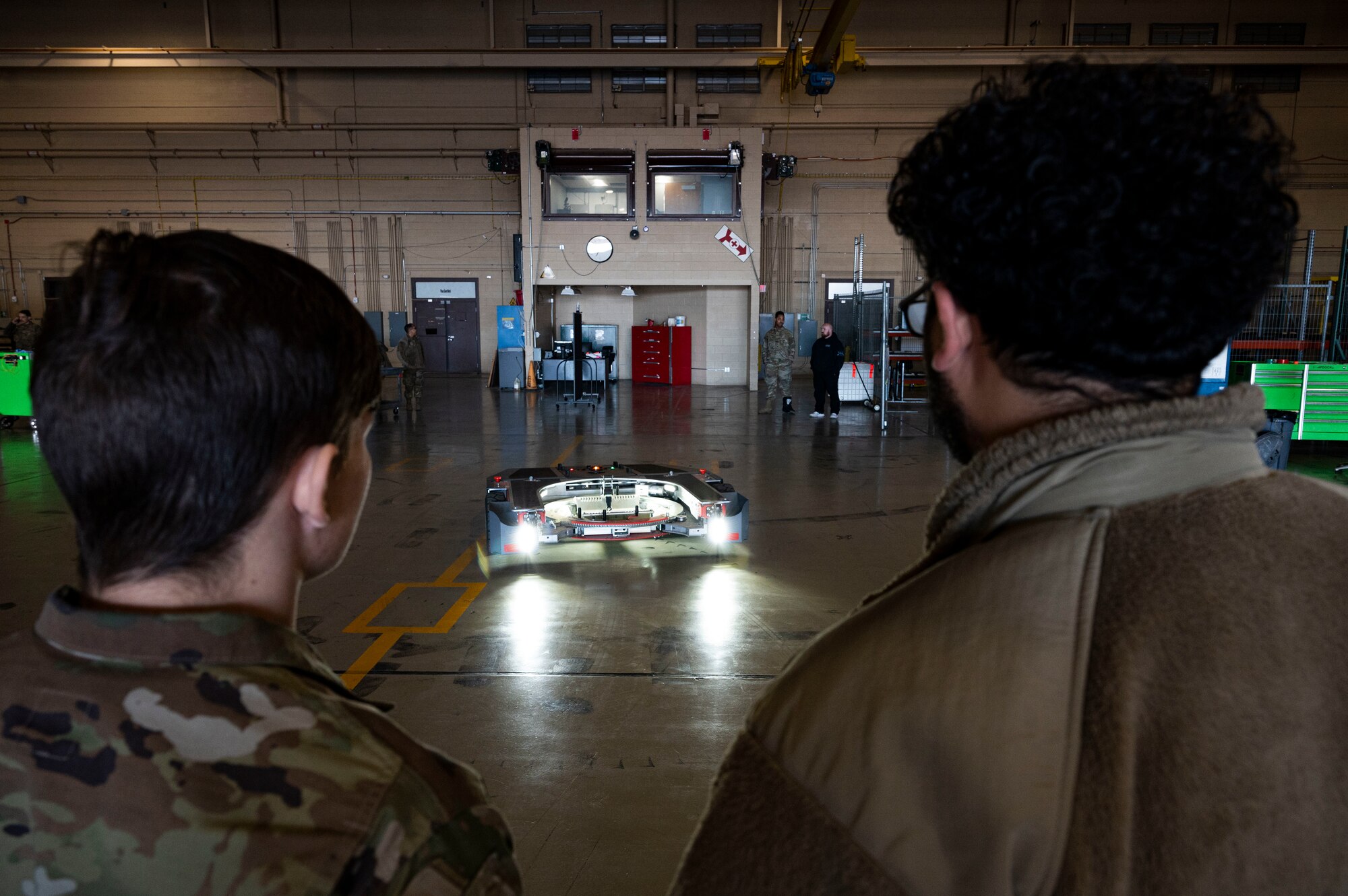 U.S. Air Force Airman 1st Class Quin Lamon, left, and Airman 1st Class Eddie Rosario, 49th Equipment Maintenance Squadron aircraft inspection section journeymen, conduct an inspection on a TowFLEXX TF5 at Holloman Air Force Base, New Mexico, Dec. 1, 2023. The 49th EMS phase sections work hand-in-hand with the other aircraft maintenance units across base to ensure that Holloman’s pilots continue to conduct safe flight operations. (U.S. Air Force photo by Airman 1st Class Isaiah Pedrazzini)