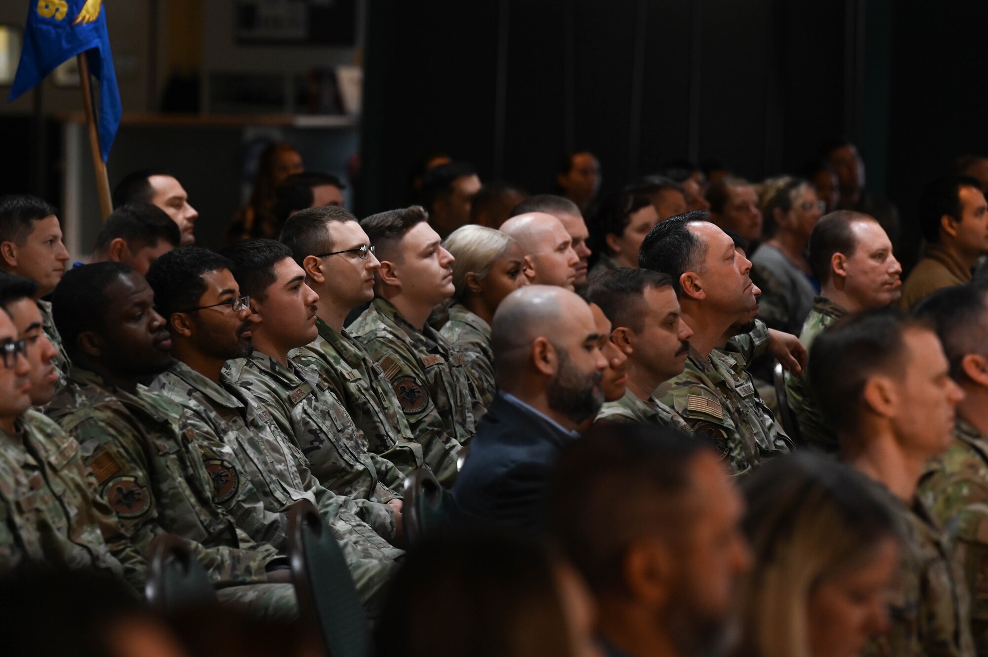 Members from the 87th Electronic Warfare Squadron attend the Airman Leadership School Class 24-Alpha graduation at Eglin Air Force Base, Fla., Dec. 7, 2023. The 87th EWS was there in support of one of their members who was graduating the school that evening. (U.S. Air Force photo by Capt. Benjamin Aronson)