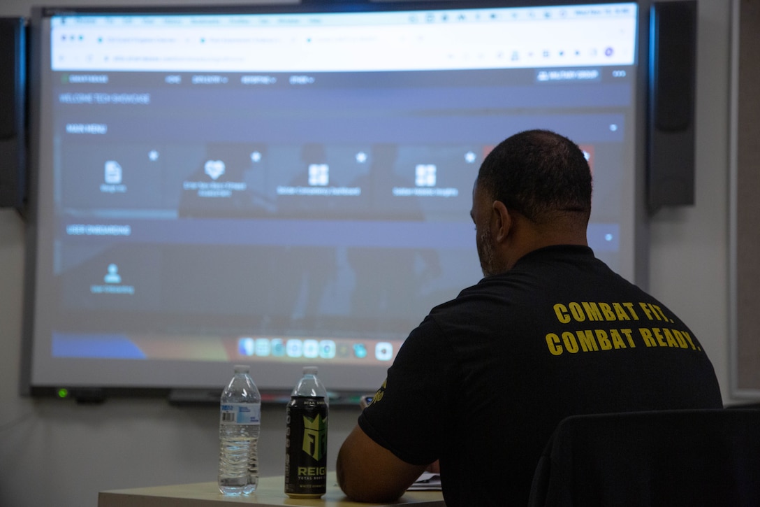 Raymond Anderson, director of Strength and Conditioning, MCCS Lejeune-New River WARR Program, listens to a presentation about the Smartabase platform at the Wallace Creek Fitness Center on Marine Corps Base Camp Lejeune, North Carolina, Nov. 15, 2023. The Smartabase platform will be implemented at the Marine Corps Community Services Warrior Athlete Readiness and Resilience Center to centralize and analyze the collected fitness data throughout a service member’s lifecycle.