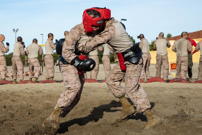 U.S. Marine Corps recruits with Bravo Company, 1st Recruit Training Battalion, participate in a body sparring event at Marine Corps Recruit Depot San Diego, Dec. 4, 2023. Body sparring teaches recruits self-defense and instills a combat warrior mindset. (U.S. Marine Corps photo by Lance Cpl. Sarah M. Grawcock)