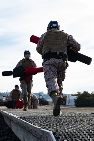 U.S. Marine Corps recruits with Bravo Company, 1st Recruit Training Battalion, participate in a pugil sticks event at Marine Corps Recruit Depot San Diego, Dec. 4, 2023. Pugil sticks teaches recruits self-defense and instills a combat warrior mindset. (U.S. Marine Corps photo by Lance Cpl. Sarah M. Grawcock)