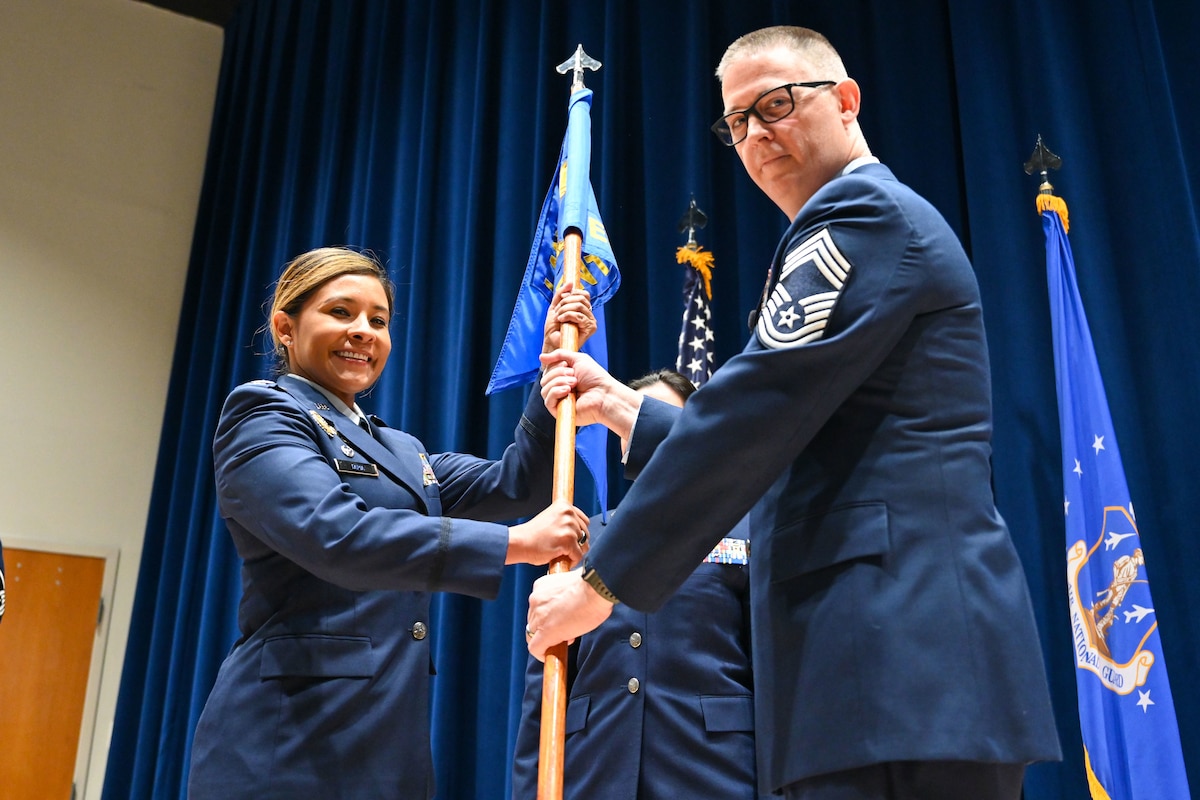 U.S. Air Force Chief Master Sgt. Paul A. Butts accepts the guidon from Col. Angela M. Tapia, commander, I.G. Brown Training and Education Center, during a change of responsibility ceremony on Dec. 7, 2023, at McGhee Tyson Air National Guard Base, Tennessee. Butts is the 18th commandant of the Paul H. Lankford Center for Professional Military Education Center, and the senior enlisted advisor for the commander of the TEC.