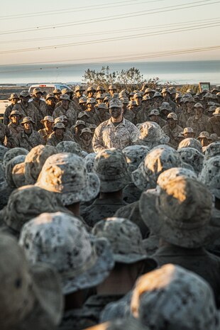 U.S. Marines with Lima Company, 3rd Recruit Training Battalion, listen to a speech after receiving their Eagle, Globe, and Anchor’s at Marine Corps Base Camp Pendleton, California, Dec. 6, 2023. The Reaper hike is the last event recruits must complete before they earn the title of United States Marine. (U.S. Marine Corps photo by Lance Cpl. Jacob B. Hutchinson)