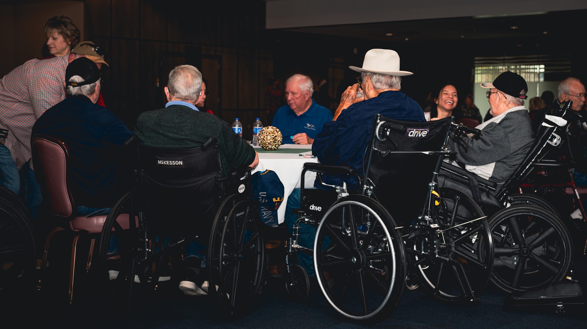 Veterans speak with each other at Air Force base.