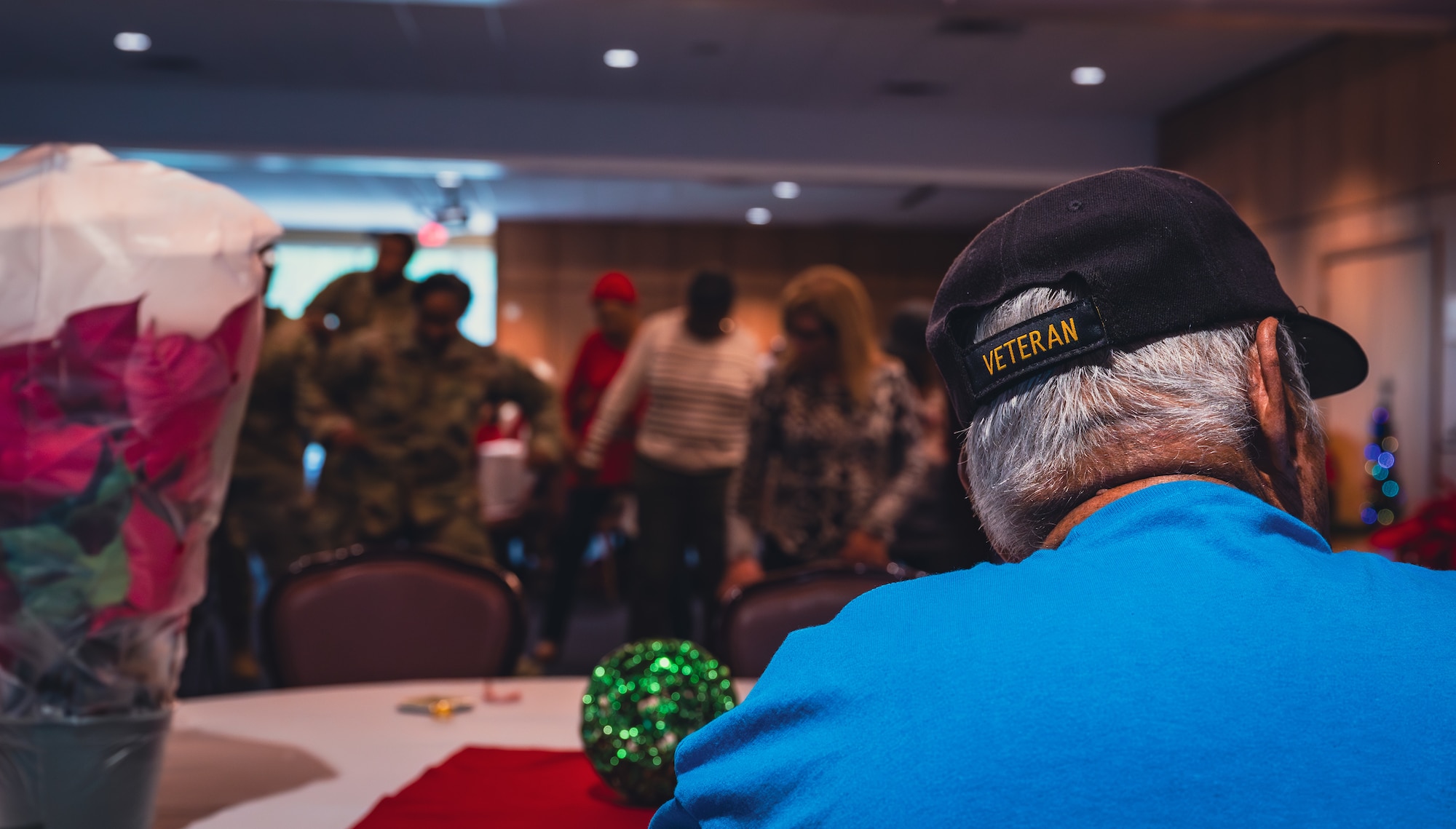 Veteran sits at table at Air Force Base