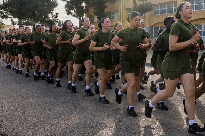 New U.S. Marines with Charlie Company, 1st Recruit Training Battalion, participate in a motivational run at Marine Corps Recruit Depot San Diego, Dec. 7, 2023. The motivational run is the final training event new Marines complete before graduating which consists of a three-mile run throughout the Depot. (U.S. Marine Corps photo by Lance Cpl. Jacob B. Hutchinson)