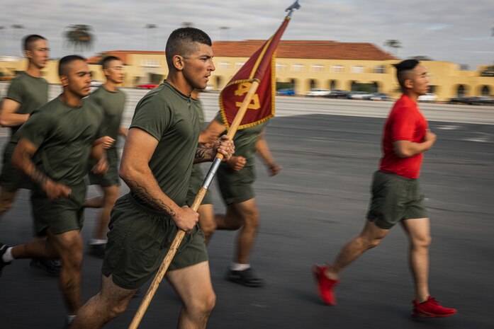 New U.S. Marines with Charlie Company, 1st Recruit Training Battalion, participate in a motivational run at Marine Corps Recruit Depot San Diego, Dec. 7, 2023. The motivational run is the final training event new Marines complete before graduating which consists of a three-mile run throughout the Depot. (U.S. Marine Corps photo by Lance Cpl. Jacob B. Hutchinson)