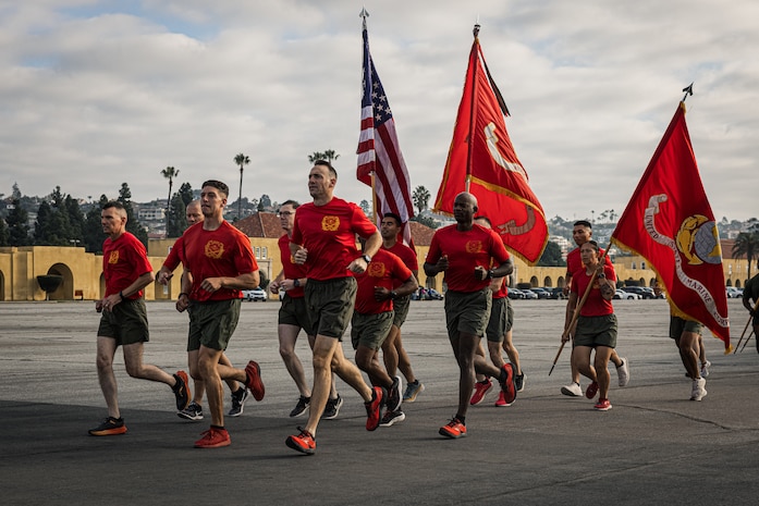 New U.S. Marines with Charlie Company, 1st Recruit Training Battalion, execute push-ups during a motivational run at Marine Corps Recruit Depot San Diego, Dec. 7, 2023. The motivational run is the final training event new Marines complete before graduating which consists of a three-mile run throughout the Depot. (U.S. Marine Corps photo by Lance Cpl. Jacob B. Hutchinson)