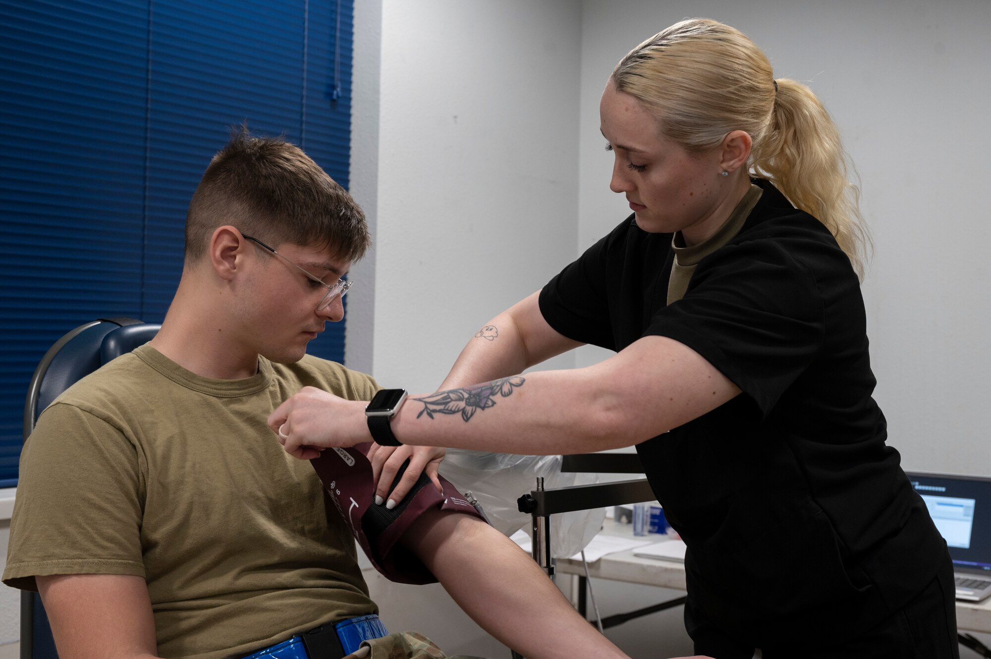 U.S. Air Force Senior Airman Tiffany O’Neal, 7th Operational Medical Readiness Squadron dental flight dental assistant, checks Senior Airman Maxwell Kosko’s, 317th Aircraft Maintenance Squadron environmental electrical technician, blood pressure during a dental exam in the Mobile Dental Clinic at Dyess Air Force Base, Texas, Nov. 30, 2023. The 7th OMRS is promoting readiness through the new Mobile Dental Clinic by providing dental care to Airmen working swing and mid shift hours, ensuring a medically ready and deployable force. (U.S. Air Force photo by Airman 1st Class Alondra Cristobal Hernandez)