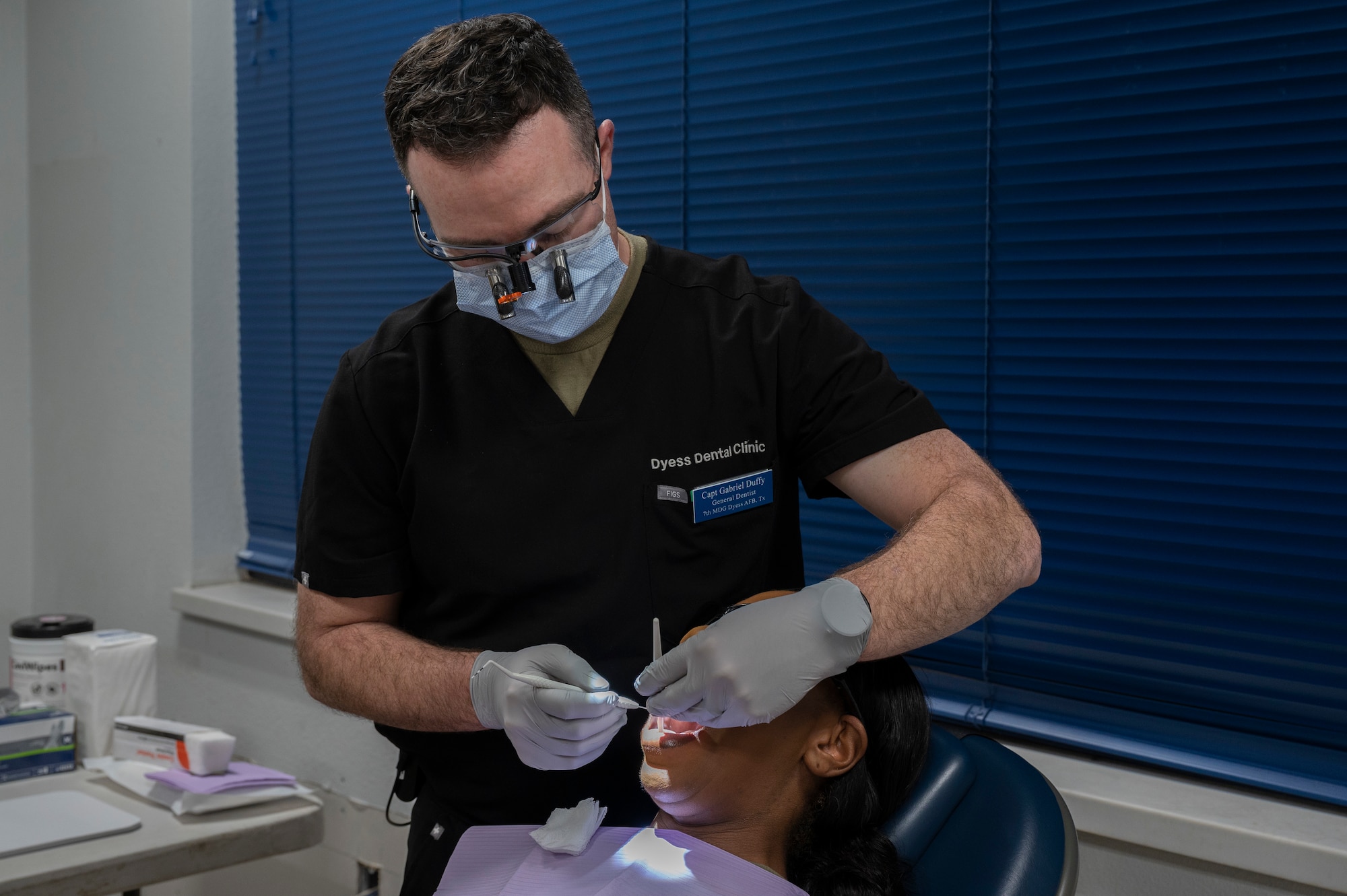 U.S. Air Force Capt. Gabriel Duffy, 7th Operational Medical Readiness Squadron dental flight dentist, performs a dental exam on Senior Airman Avonia Satchell, 317th Aircraft Maintenance Squadron electrical and environmental technician, in the Mobile Dental Clinic at Dyess Air Force Base, Texas, Nov. 30, 2023. The new Mobile Dental Clinic uses expeditionary mobilization equipment that most clinics do not have to bring their services to Airmen, offering them less time away from work, and dental care during times where clinics aren’t normally open. (U.S. Air Force photo by Airman 1st Class Alondra Cristobal Hernandez)