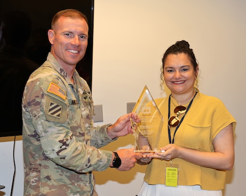 Jacksonville District Deputy Commander, Lt. Col. Matthew Miller, presents Anelis Nazario-Castillo the SAD ECAP Contract Specialist of the Year Award.