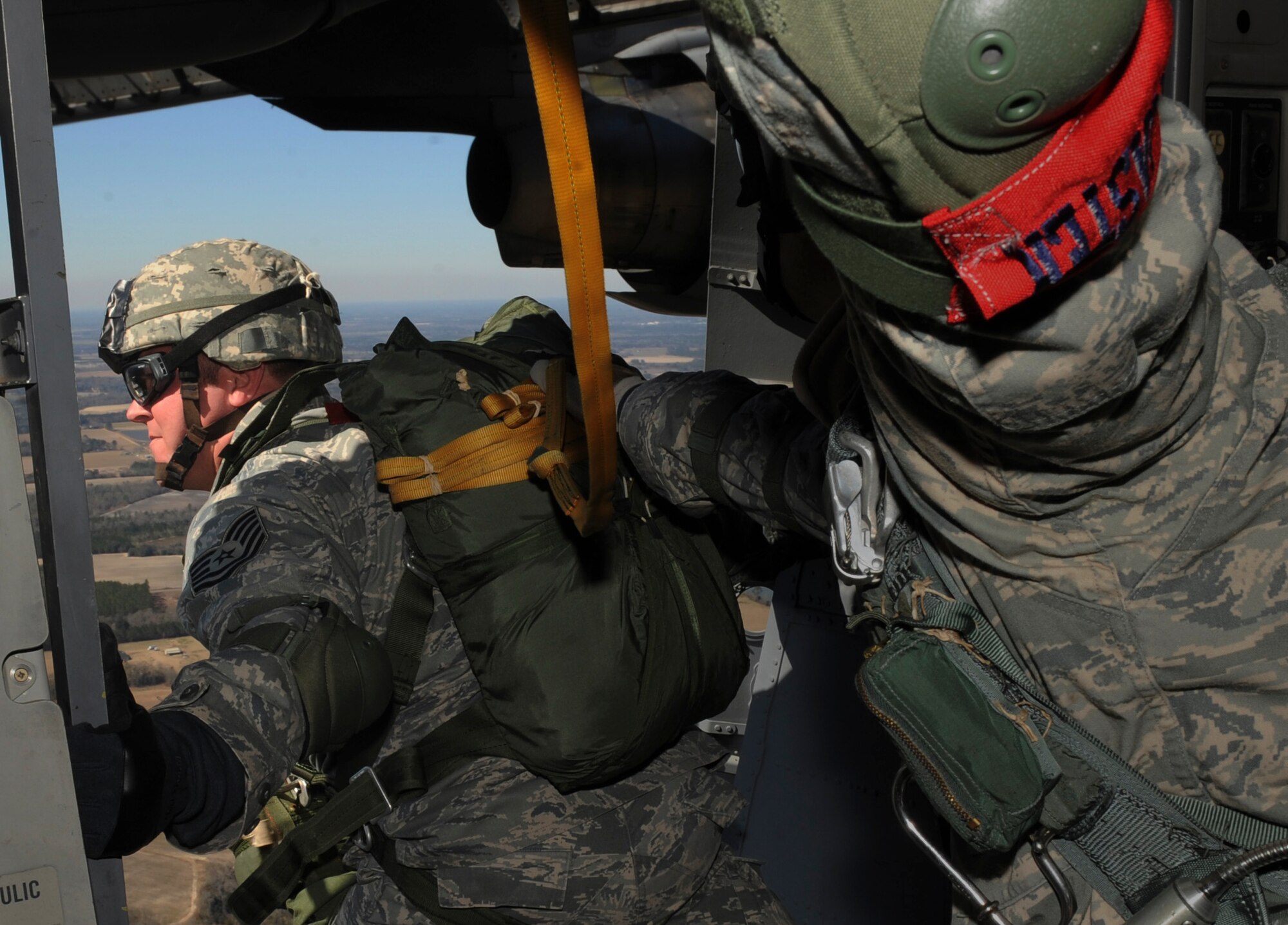 A U.S. Air Force Airman with the 820th Security Forces Group prepares to perform a static line parachute jump out of a C-17 Globemaster III aircraft over Moody Air Force Base, Ga., Feb. 5, 2009. The 820th SFG did a joint jump with members from the Royal Air Force. (U.S. Air Force photo by Senior Airman Gina Chiaverotti)