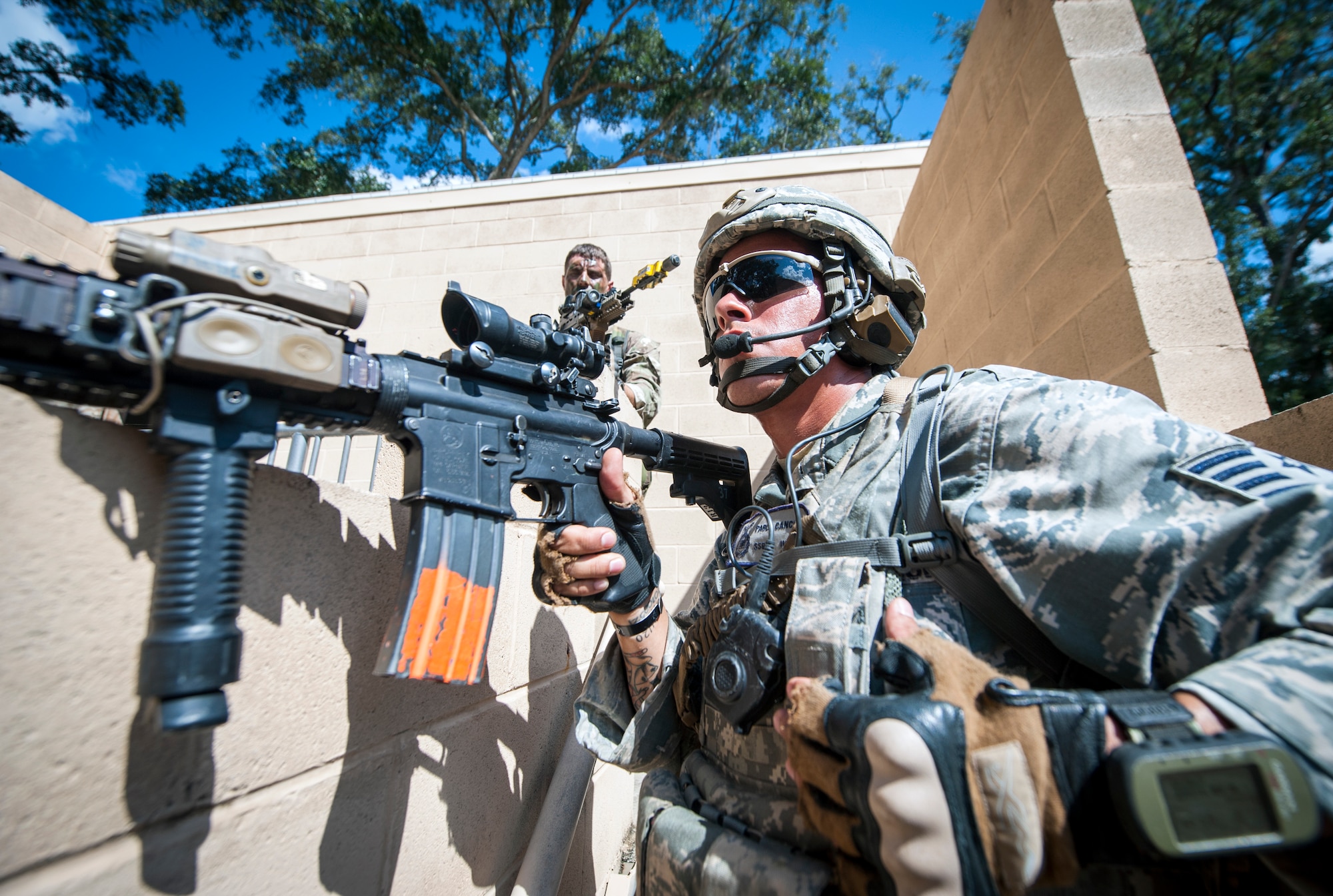 U.S. Air Force Staff Sgt. Pablo Cancel, 822d Base Defense Squadron, keeps a lookout at the military operations in urban terrain (MOUT) village during Exercise GLOBAL EAGLE at Moody Air Force Base, Ga., Oct. 17, 2013. The training scenario took place at the MOUT village and was meant to simulate scenarios they may face while deployed. (U.S. Air Force photo by Senior Airman Jarrod Grammel)