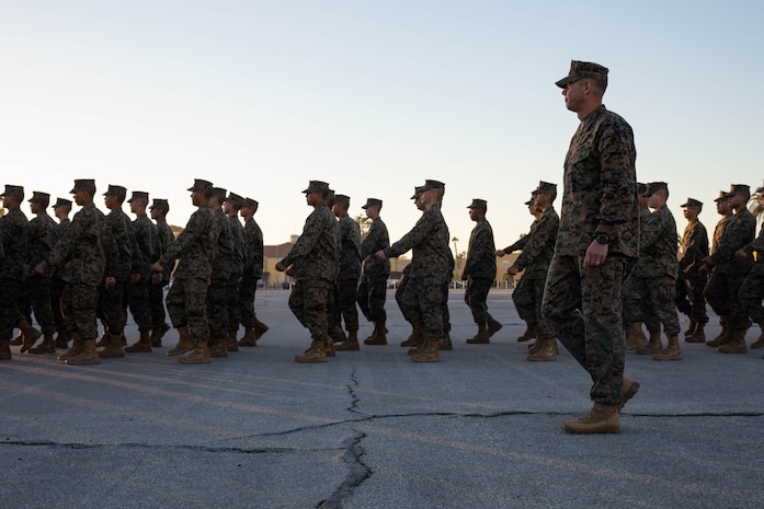 Sgt. Maj. Carlos Ruiz, the 20th Sergeant Major of the Marine Corps, calls cadence for Marines with Fox Company, 2nd Recruit Training Battalion, at Marine Corps Recruit Depot San Diego, Dec.5, 2023. Ruiz visited the Depot to listen to the ideas, questions, and concerns of Marines throughout the installation on how to improve the Marine Corps and recruiting mission. (U.S. Marine Corps photo by Lance Cpl. Sarah M. Grawcock)