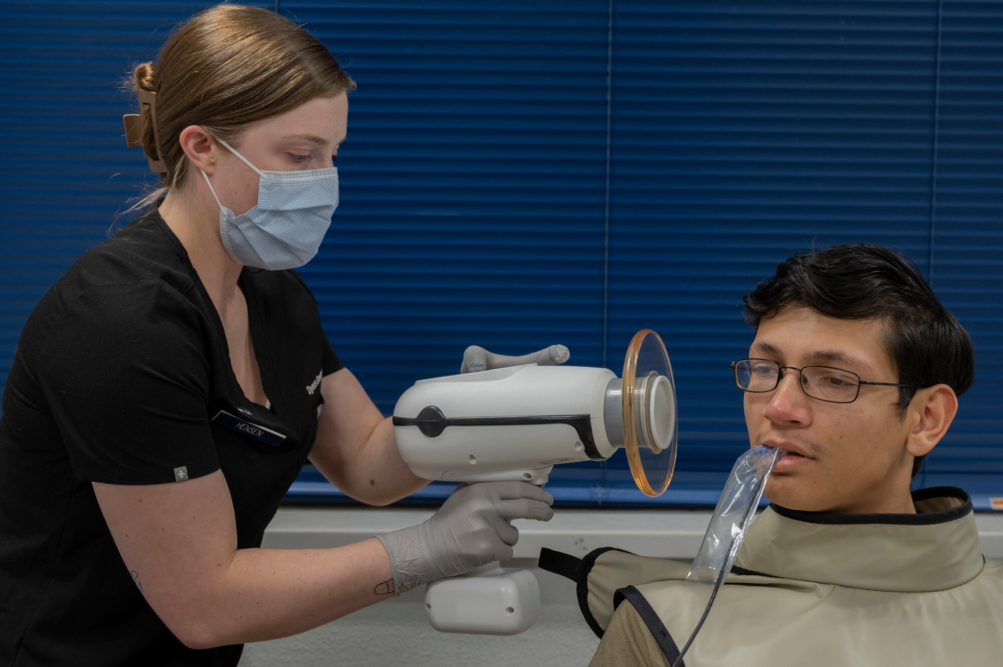U.S. Air Force Senior Airman Kyra Hensen, 7th Operational Medical Readiness Squadron dental assistant, performs dental x-rays on Senior Airman Anthony Meister, 317th Aircraft Maintenance Squadron aerospace propulsion technician, in the Mobile Dental Clinic at Dyess Air Force Base, Texas, Nov. 30, 2023. The new Mobile Dental Clinic capability allows expanded access to care to shift workers along with ensuring Dyess member’s readiness rates remain in a “ready now” status and don’t hinder their worldwide qualification statuses. (U.S. Air Force photo by Airman 1st Class Alondra Cristobal Hernandez)