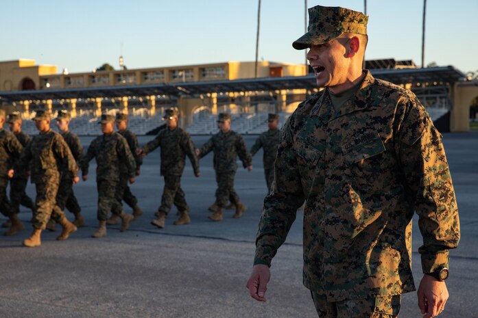 Sgt. Maj. Carlos Ruiz, the 20th Sergeant Major of the Marine Corps, calls cadence for Marines with Fox Company, 2nd Recruit Training Battalion, at Marine Corps Recruit Depot San Diego, Dec.5, 2023. Ruiz visited the Depot to listen to the ideas, questions, and concerns of Marines throughout the installation on how to improve the Marine Corps and recruiting mission. (U.S. Marine Corps photo by Lance Cpl. Sarah M. Grawcock)