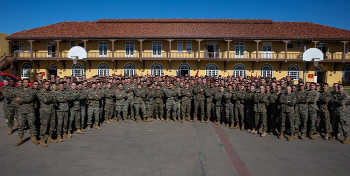 Sgt. Maj. Carlos Ruiz, the 20th Sergeant Major of the Marine Corps, poses for a photo with students of Basic Recruiters School at Marine Corps Recruit Depot San Diego, Dec. 5, 2023. Ruiz visited the Depot to listen to the ideas, questions, and concerns of Marines throughout the installation on how to improve the Marine Corps and recruiting mission. (U.S. Marine Corps photo by Lance Cpl. Sarah M. Grawcock)