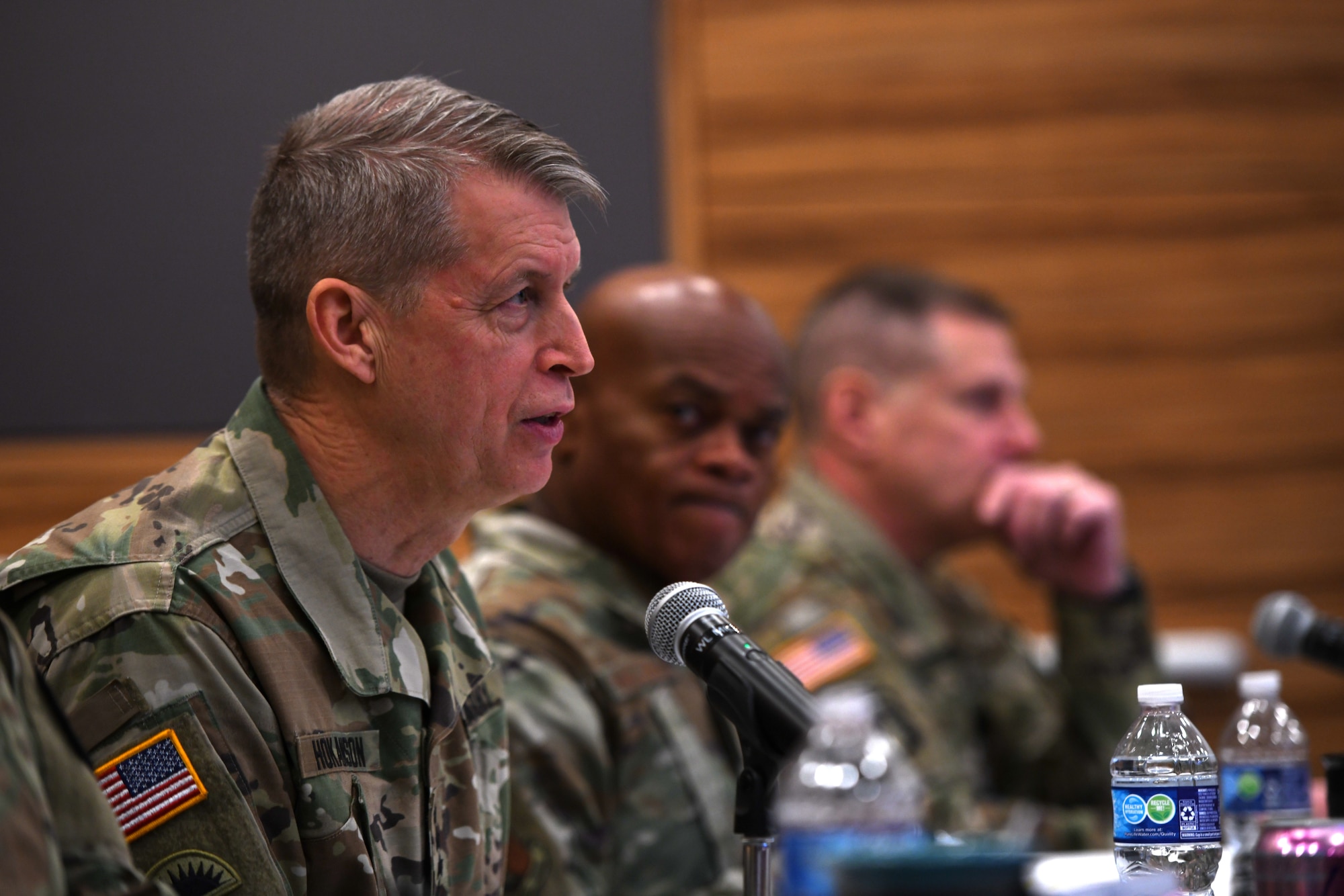 Army Gen. Daniel Hokanson, chief of the National Guard Bureau, poses a question to a competitor during the 2023 National Guard Bureau Innovation Challenge at the Herbert R. Temple Jr. Army National Guard Readiness Center, Arlington Hall Station, Virginia, Dec. 7, 2023. The competition was created to find innovative solutions to challenges facing National Guard elements while building an “innovation ecosystem” among Soldiers, Airmen and Guard civilians.