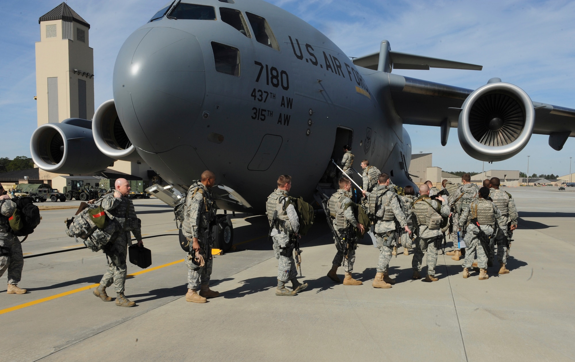 Members of the 820th Security Forces Group board a C-17 Globemaster III in preparation for a deployment to Haiti, Jan. 28, 2010. The 820th SFG’s mission while in Haiti will be to provide security and assistance at the Toussaint L’Ouverture International Airport in Port-au-Prince, Haiti. (U.S. Air Force photo by Airman 1st Class Benjamin Wiseman)