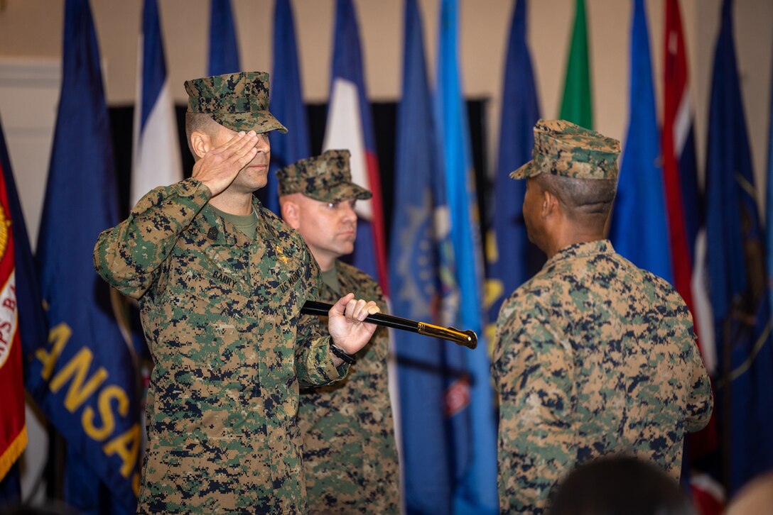 U.S. Marine Corps Sgt. Maj. Collin D. Barry, outgoing sergeant major, Marine Corps Base Quantico, native of Tucumcari, New Mexico, left, salutes Col. Michael L. Brooks, base commander, MCBQ, native of South Boston, Virginia, during his relief and appointment ceremony at The Clubs at Quantico, MCBQ, Virginia, Dec. 8, 2023. U.S. Marines, family and others gathered to witness Barry retire and transfer the duties onto Sgt. Maj. Michael R. Brown as the new sergeant major of MCBQ. (U.S. Marine Corps photo by Lance Cpl. Joaquin Dela Torre)