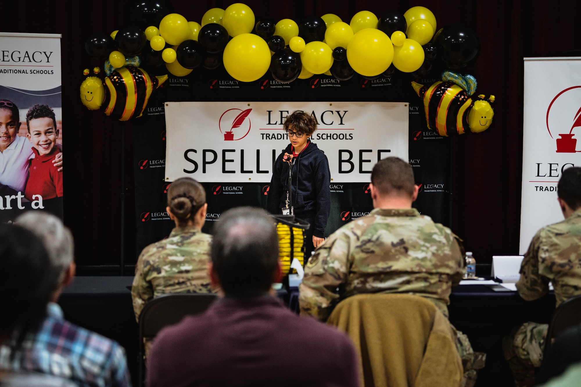 Ben Arlt, Legacy Traditional School student, participates in a spelling bee judged by Luke Air Force Base Airmen.