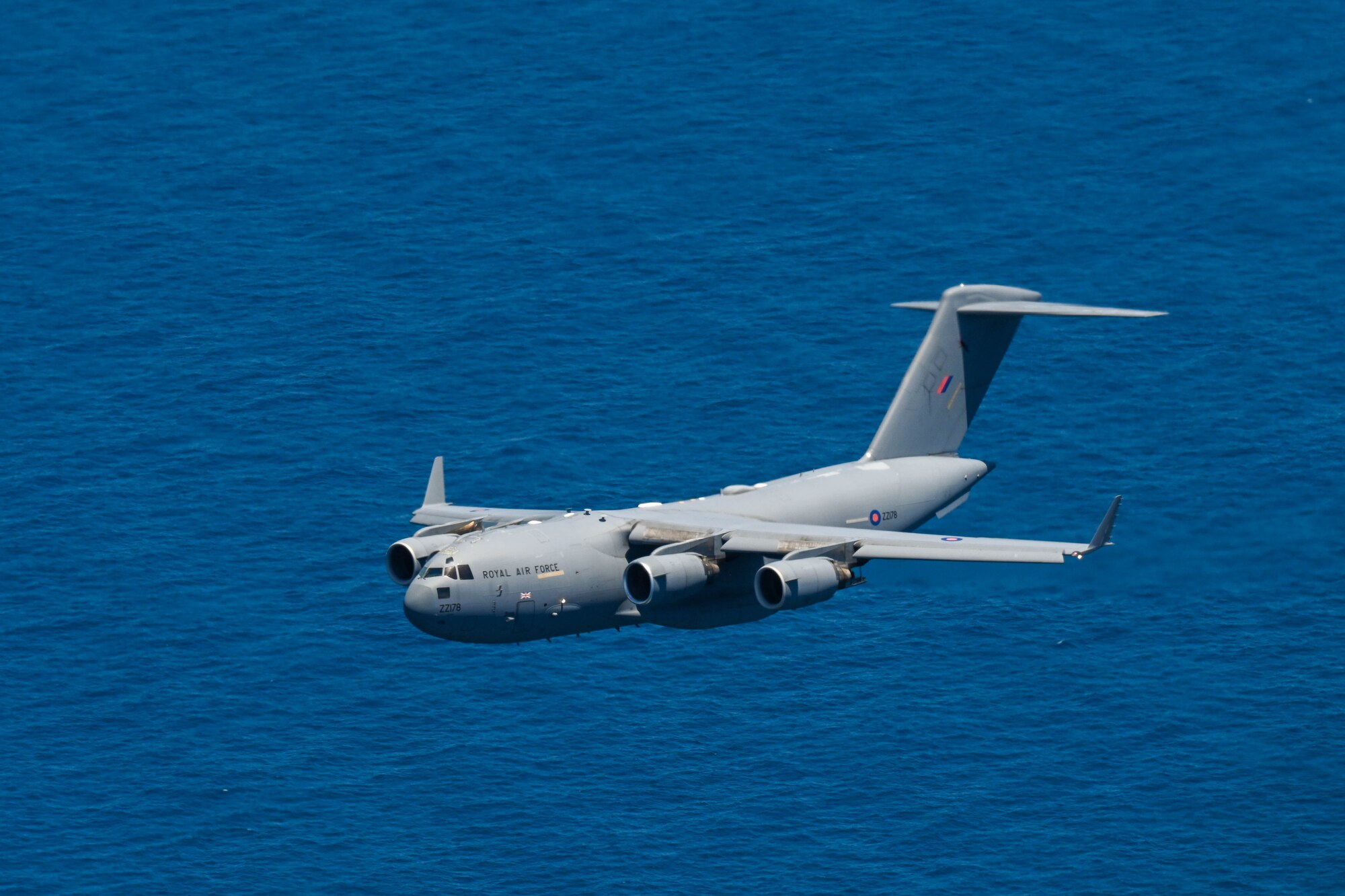 A Royal Air Force C-17 Globemaster III participates in a training flight alongside the U.S and Royal Australian Air Force during Exercise Global Dexterity 23-2 in the skies of Australia, Dec. 8, 2023. Exercise Global Dexterity prepares our air forces for combined action in wartime, peacetime and humanitarian operations throughout the Indo-Pacific. (U.S. Air Force photo by Senior Airman Makensie Cooper)