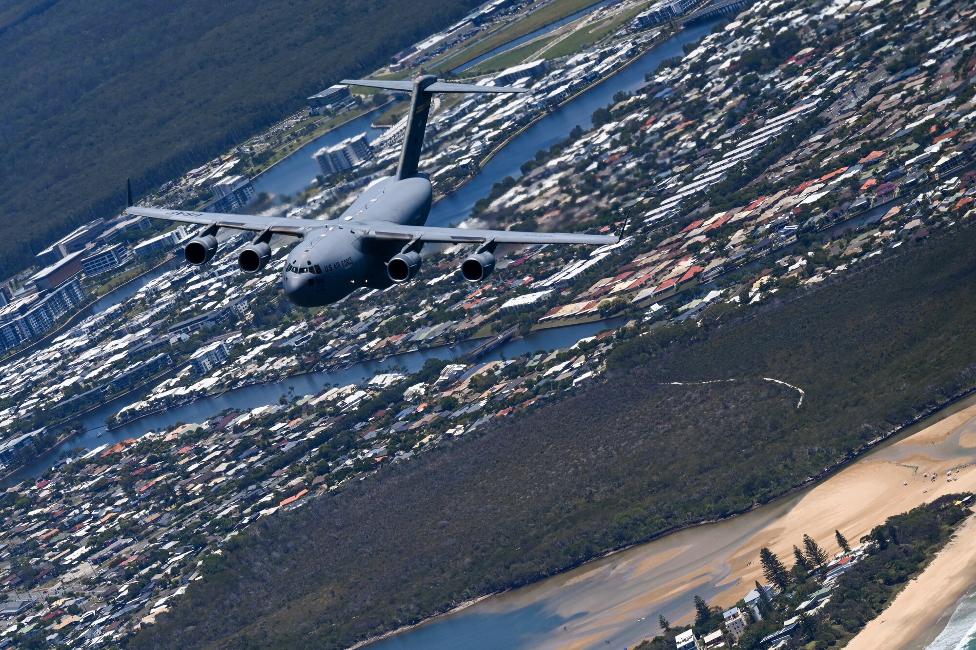 A U.S. Air Force C-17 Globemaster III participates in a training flight alongside the U.S. and Royal Australian Air Force during Exercise Global Dexterity 23-2 in the skies of Australia, Dec. 8, 2023. The exercise represents the key partnership between the U.S. and Australia that allows continued security and stability in the Indo-Pacific region. (U.S. Air Force photo by Senior Airman Makensie Cooper)