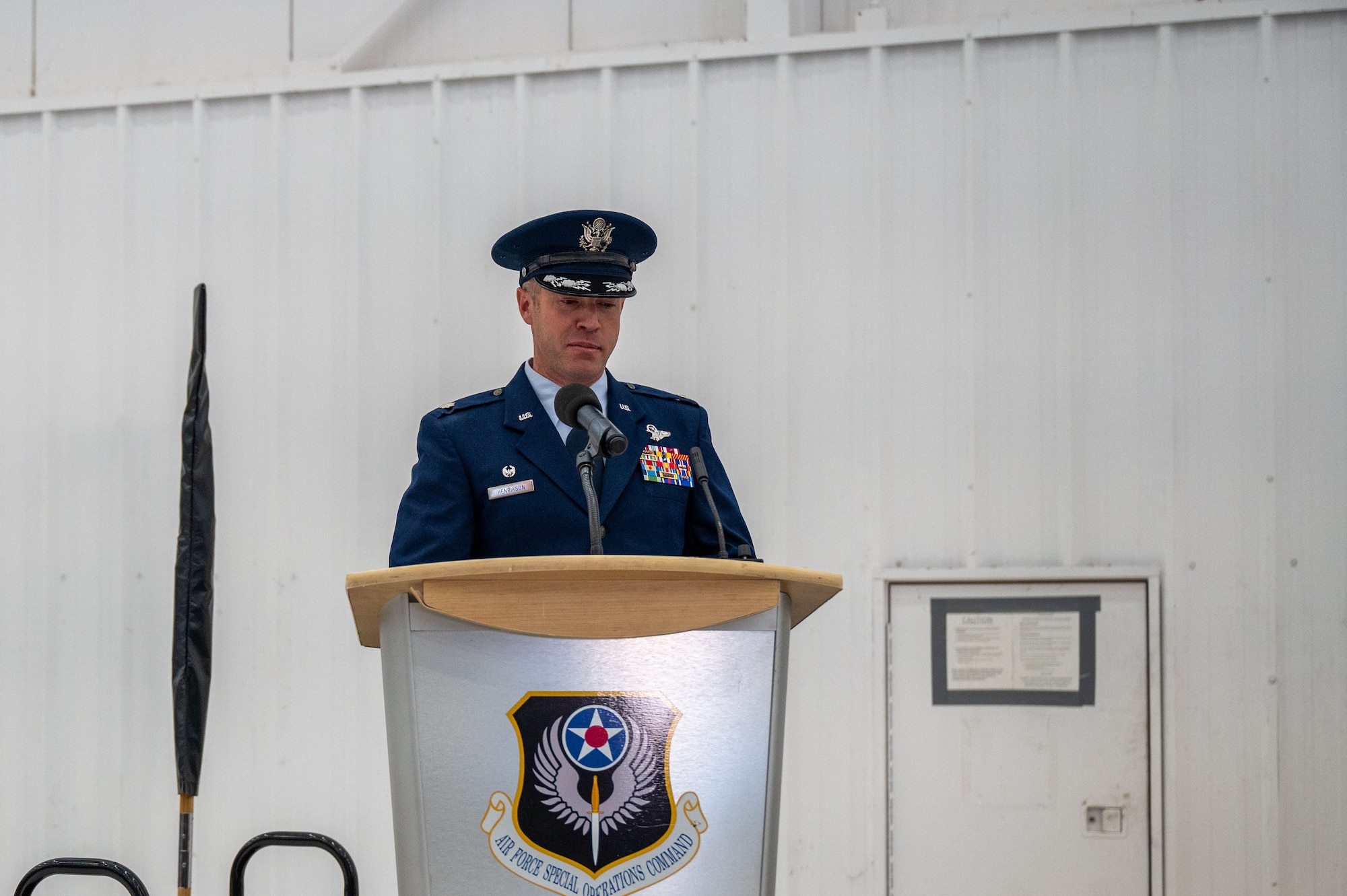 U.S. Air Force Lt. Col. Phillip Henrikson, 27th Special Operations Theater Air Operations Squadron incoming commander, gives speech during redesignation ceremony on Dec. 8, 2023, at Cannon Air Force Base, N.M. The 27th SOTAOS will help remove barriers to deeper collaboration with our allies and partners through better understanding of issues related to joint and combined capability development and production. (U.S. Air Force photo by Senior Airman Alexcia Givens)