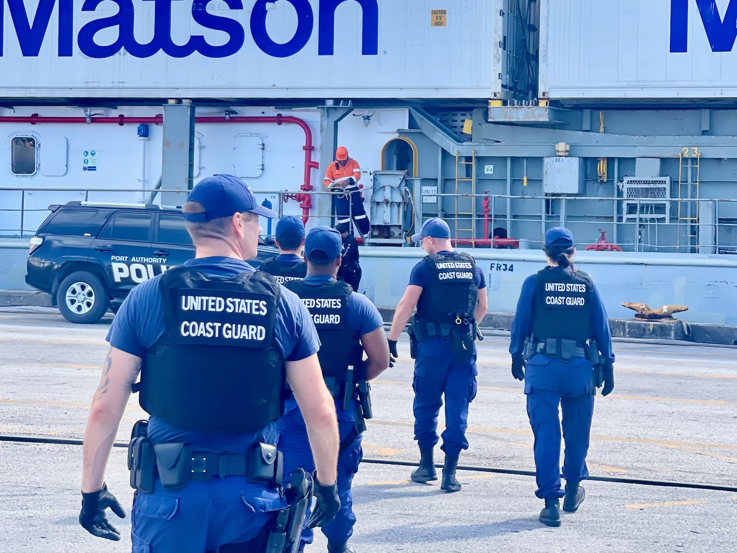 A U.S. Coast Guard Sector Boarding Team, a key component of U.S. Coast Guard Forces Micronesia/Sector Guam, conducts a thorough security boarding of the 380-foot (116-meter) motor vessel Papa Mau, flagged from Antigua Barbuda, at the Port of Guam on Dec. 6, 2023. This general cargo vessel, arriving from Pohnpei in the Federated States of Micronesia (FSM), was meticulously inspected upon reaching Guam and found to be in full compliance. (U.S. Coast Guard photo by Lt. Brian Maffucci)