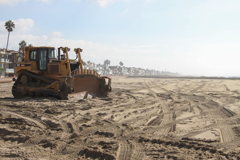 Equipment is used to push sand along the beach during a dredging and sand replenishment project Dec. 7 near Seal Beach, California. Dredging began on Stage 13 of the Surfside-Sunset Beach Replenishment project in late November, adding 1.1 million cubic yards of sand onto the beach. The project will replenish beaches along the coast of Surfside-Sunset Colony, and Seal, Huntington and Newport beaches and is expected to be completed in February 2024.