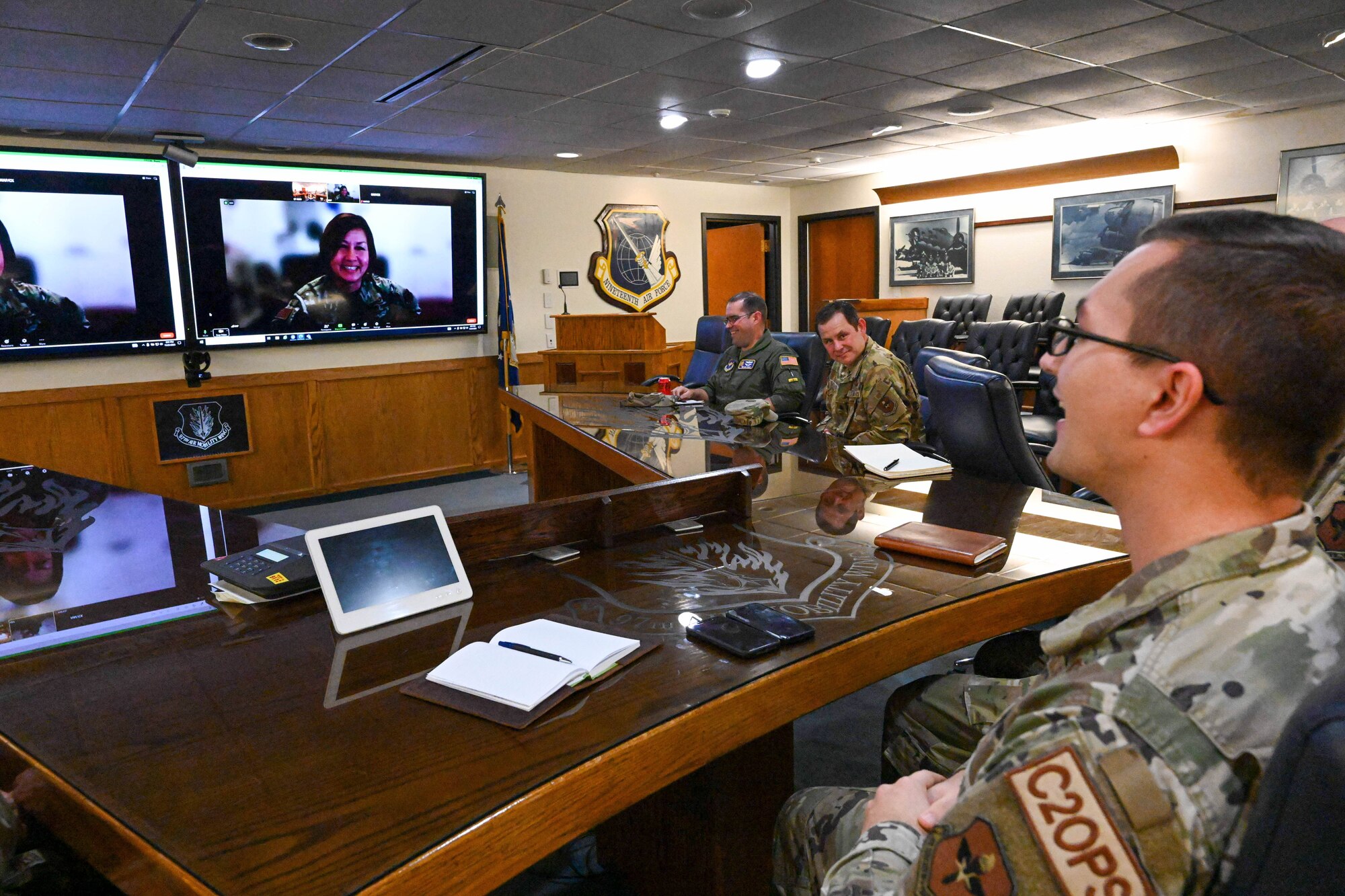 U.S. Air Force Tech. Sgt. Connor Bish, 97th Air Mobility Wing noncommissioned officer in charge of command and control operations, speaks to Chief Master Sgt. of the Air Force JoAnne S. Bass over a video call at Altus Air Force Base, Oklahoma, Nov. 21, 2023. Bish was hand selected by Bass to enter the Senior Leader Enlisted Commissioning Program - Active Duty. (U.S. Air Force photo by Senior Airman Miyah Gray)