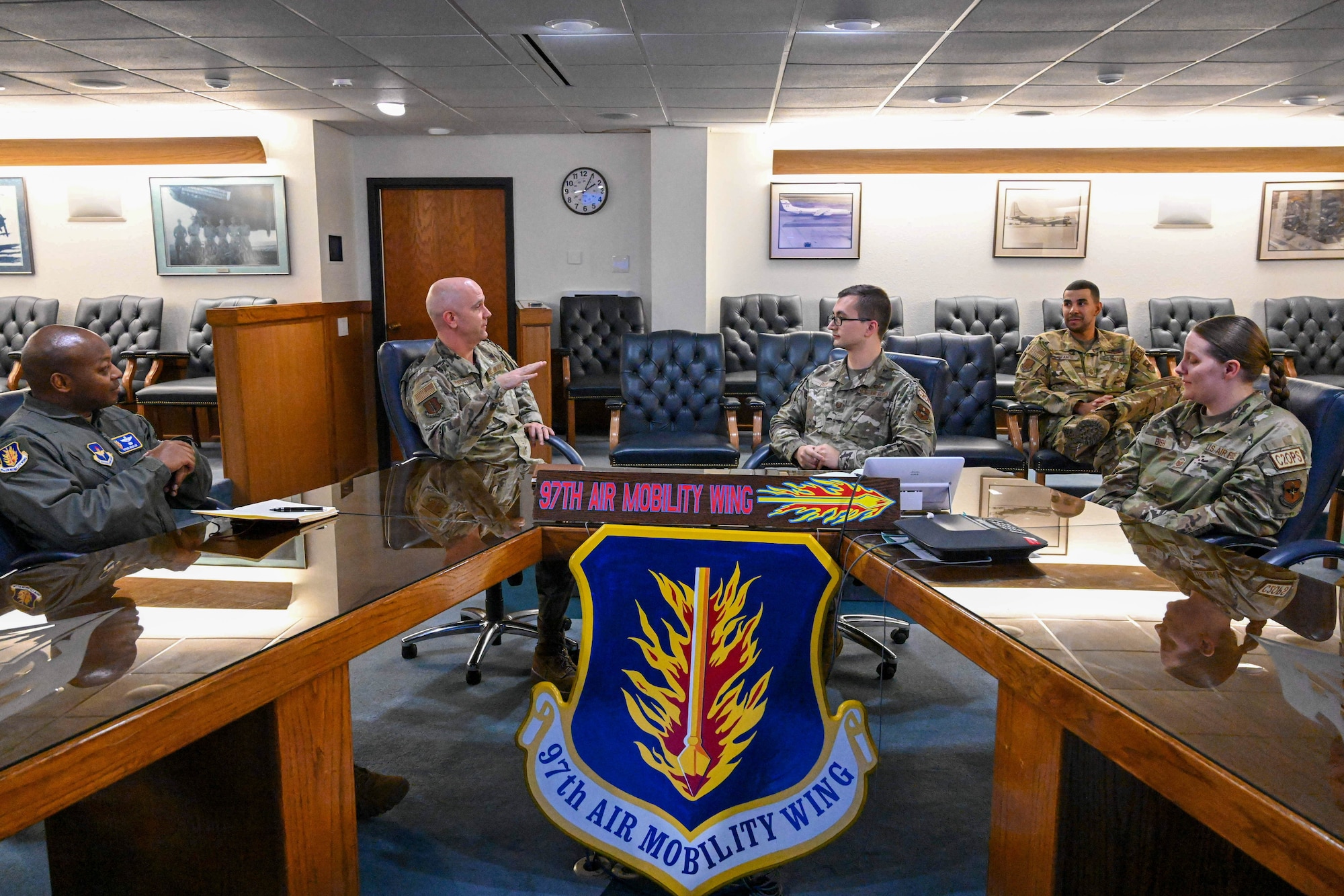 U.S Air Force Col. Jeff Marshall, left, 97th Air Mobility Wing commander, speaks to Tech. Sgt. Connor Bish, right, 97th Air Mobility Wing noncommissioned officer in charge of command and control operations, at Altus Air Force Base, Oklahoma, Nov. 21, 2023. Marshall congratulated Bish on his selection by Chief Master Sgt. of the Air Force JoAnne S. Bass to enter the Senior Leader Enlisted Commissioning Program - Active Duty. (U.S. Air Force by Senior Airman Miyah Gray)
