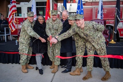 From the left, Rear Adm. Matthew Case, commander, Naval Medical Forces Atlantic, and director, Defense Health Network Atlantic, Lisa Lucas-Burke, vice mayor, City of Portsmouth, Surgeon General of the Navy Rear Adm. Darin Via, Dr. Michael Malanoski, deputy director, Defense Health Agency, Capt. Shelley Perkins, deputy commander, Naval Medical Forces Atlantic, and Capt. Brian Feldman, commanding officer, Navy Medicine Readiness & Training Command Portsmouth, and director, Naval Medical Center Portsmouth (NMCP), cut a ribbon during a trauma center ribbon cutting ceremony in front of NMCP’s emergency room entrance on Dec. 8.