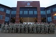U.S. Army Reserve, National Guard and U.S. Army V Corps senior leaders pose for a photo in front of V Corps Headquarters before the second annual Reserve Component Symposium in Fort Knox, Kentucky, Dec. 2, 2023. The second annual Reserve Component Symposium provided an ideal opportunity for commanders of relevant U.S. Army Reserve formations, state adjutants general, deputies and key staff to discuss challenges, opportunities, lessons-learned, and tactics, techniques and procedures with V Corps and U.S. Army Europe and Africa senior leaders and key advisors. (U.S. Army photo by Sgt. Javen Owens)