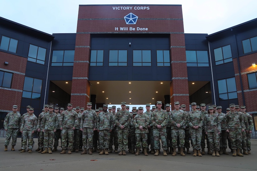 U.S. Army Reserve, National Guard and U.S. Army V Corps senior leaders pose for a photo in front of V Corps Headquarters before the second annual Reserve Component Symposium in Fort Knox, Kentucky, Dec. 2, 2023. The second annual Reserve Component Symposium provided an ideal opportunity for commanders of relevant U.S. Army Reserve formations, state adjutants general, deputies and key staff to discuss challenges, opportunities, lessons-learned, and tactics, techniques and procedures with V Corps and U.S. Army Europe and Africa senior leaders and key advisors. (U.S. Army photo by Sgt. Javen Owens)