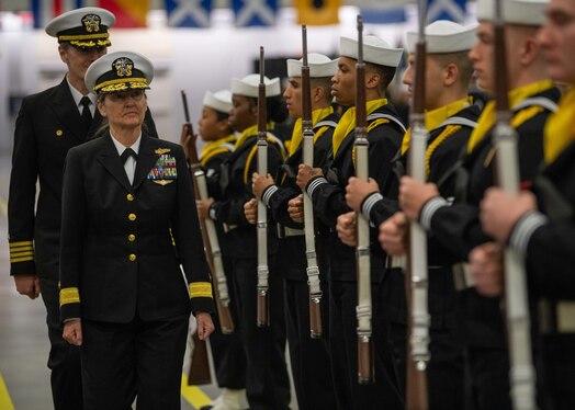  Rear Adm. Ingrid Rader  inspects the honor guard during a pass-in-review graduation ceremony at RTC.